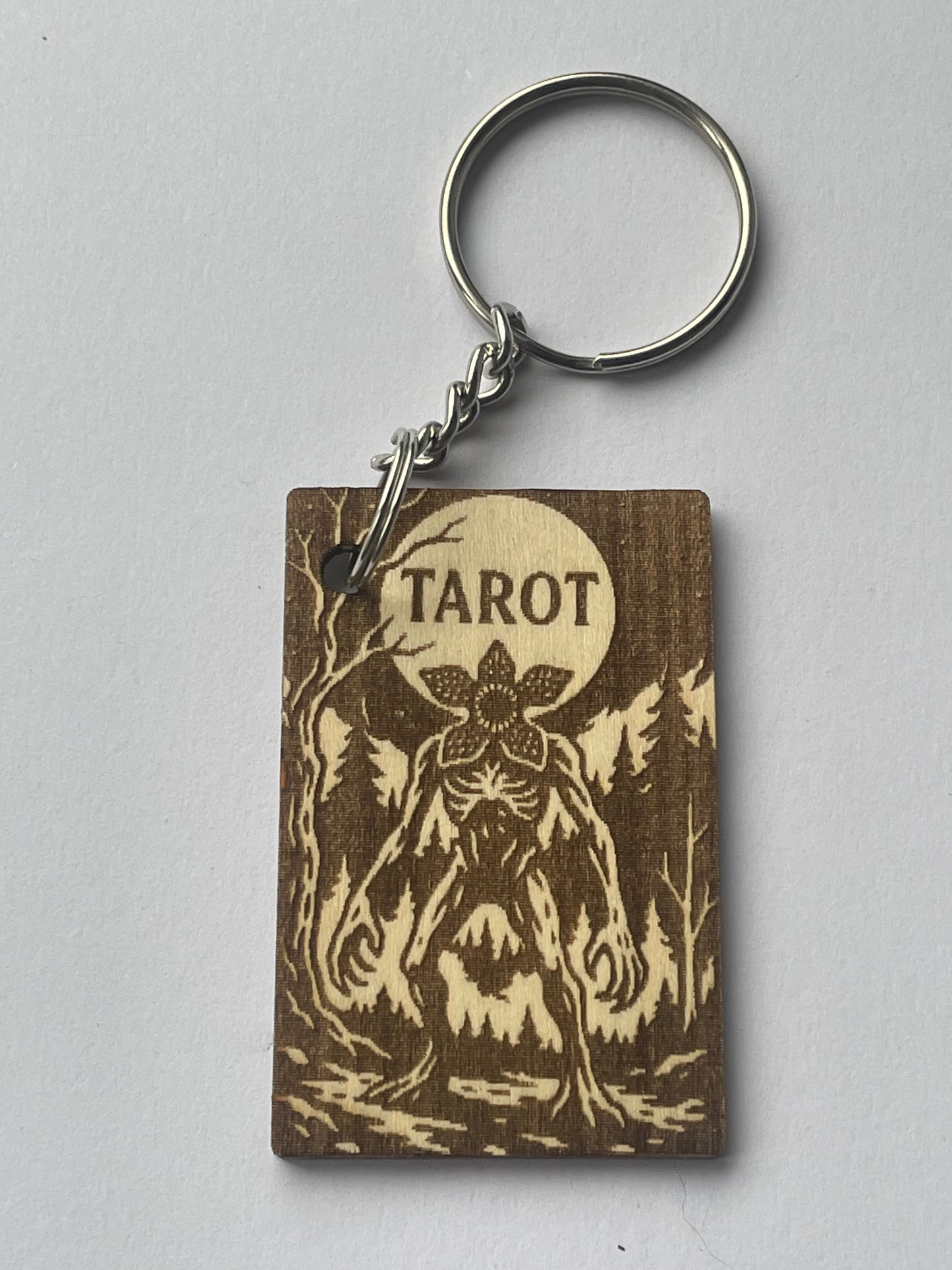 Keychain with tarot design on a gray background