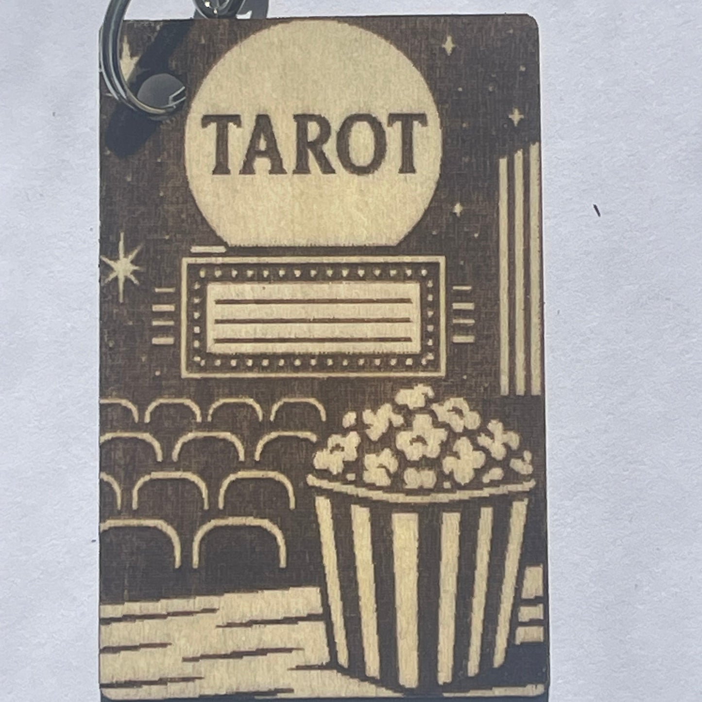 Keychain with 'Tarot' design on a light gray background