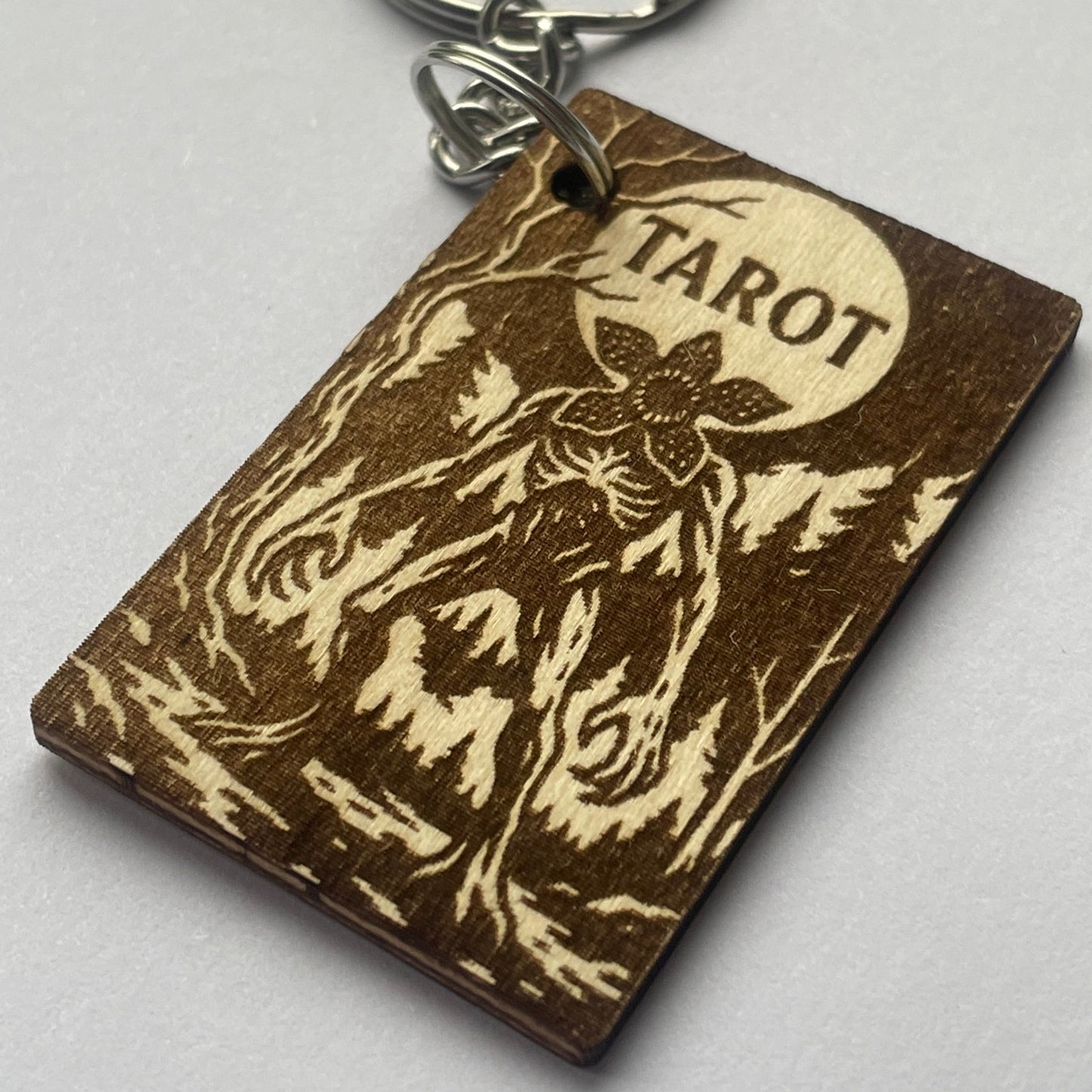 Keychain with 'Tarot' design on a gray background