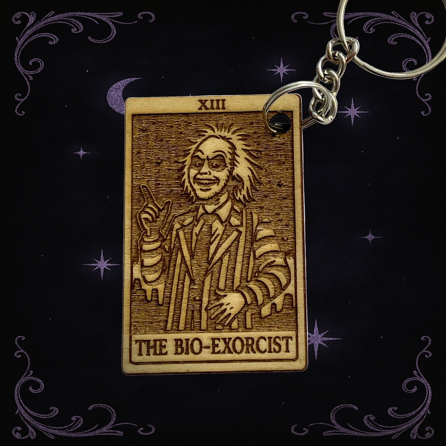 Keychain with 'The Bio-Exorcist' design on a dark background
