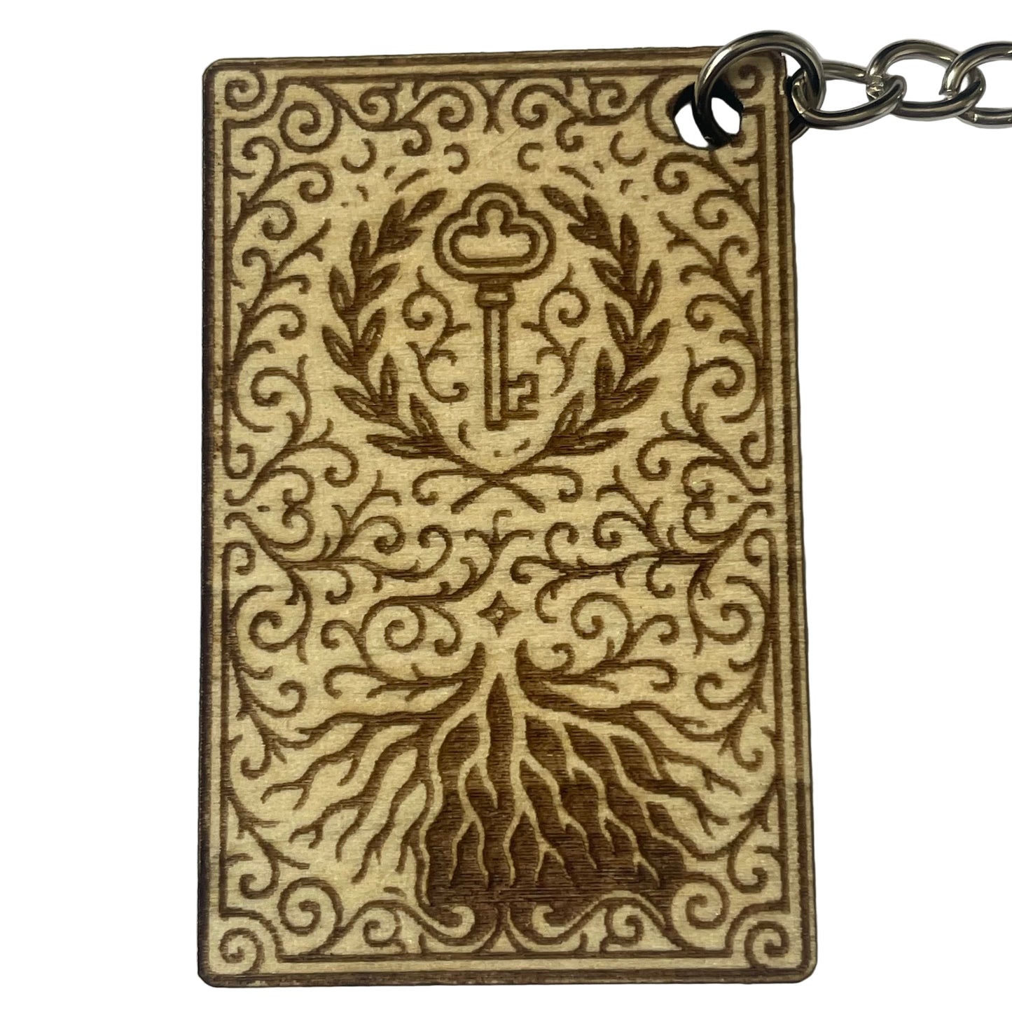 Decorative keychain with intricate design on a plain background