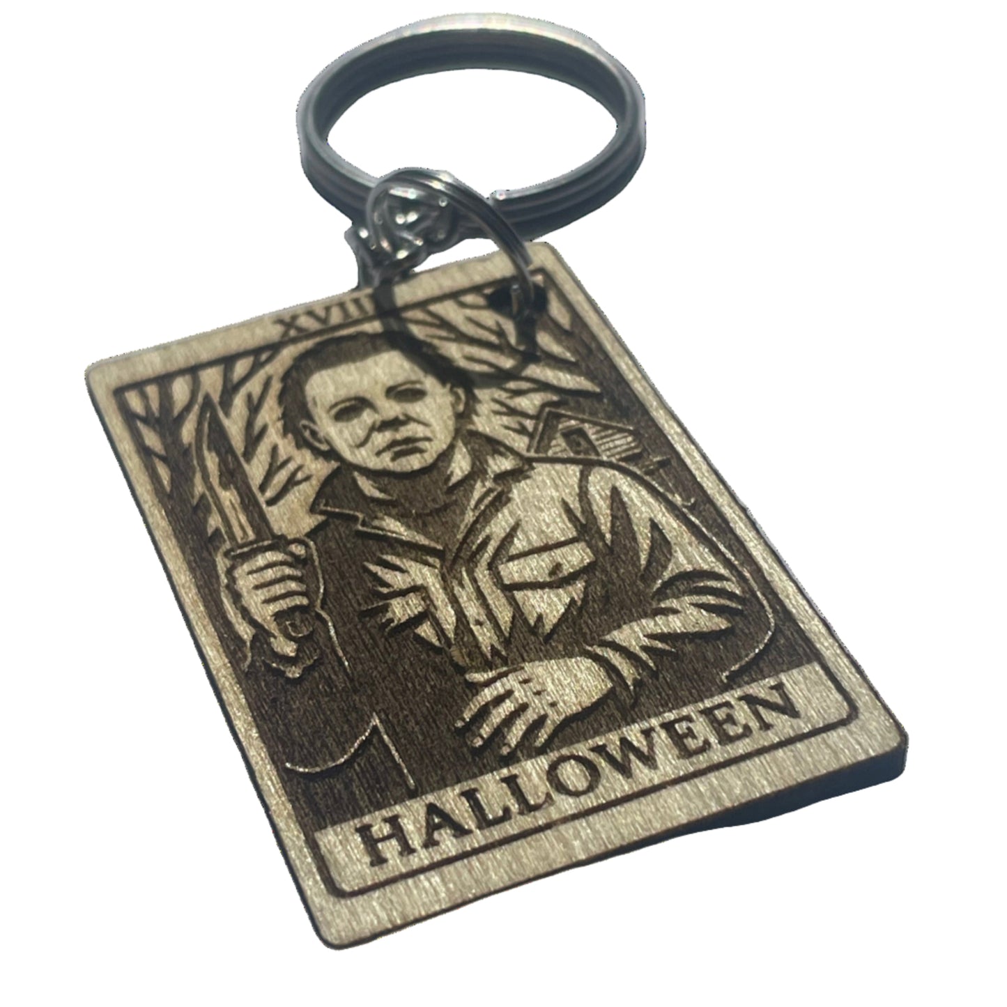 Wooden keychain with Halloween design on a gray background