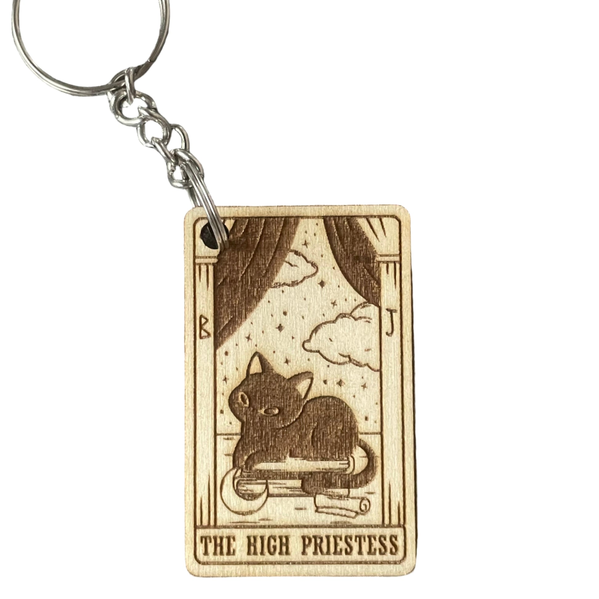Keychain with 'The High Priestess' tarot card design on a gray fabric background