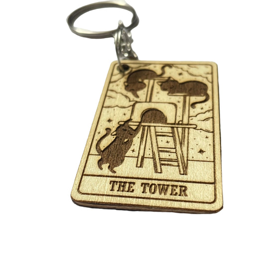 The tower cat keyring engraved on wood