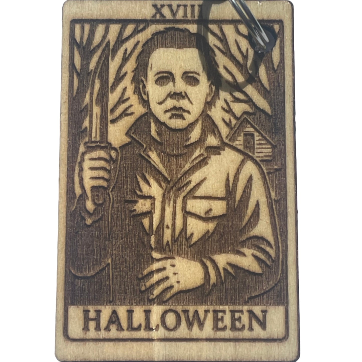 Wooden keychain with Halloween design on a white background