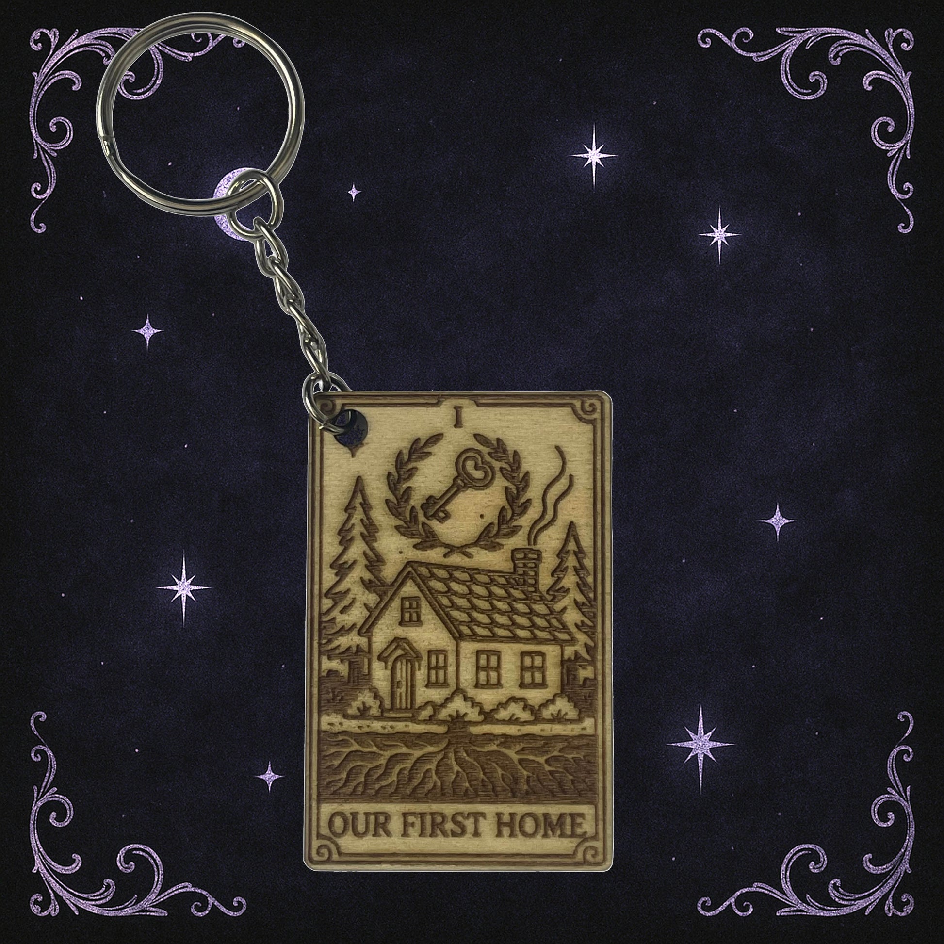 Keychain with house illustration and 'Our First Home' text on a decorative background