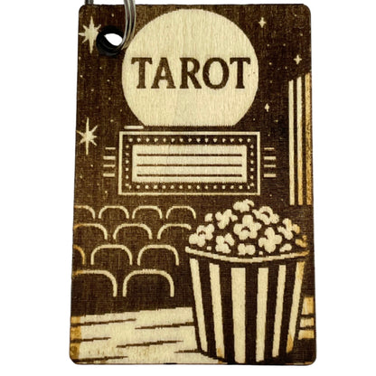 Wooden keychain with 'Tarot' engraving on a white background