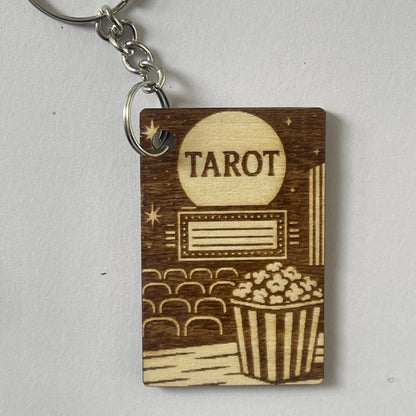 Wooden keychain with 'Tarot' engraving on a light gray background
