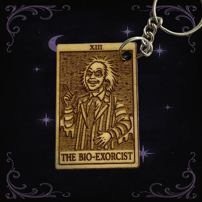 Keychain with 'The Bio-Exorcist' design on a dark background