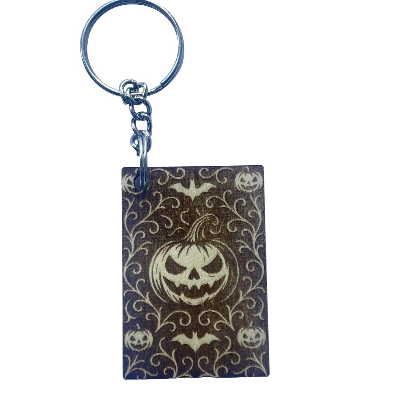 Keychain with Halloween design featuring pumpkins and bats on a purple background
