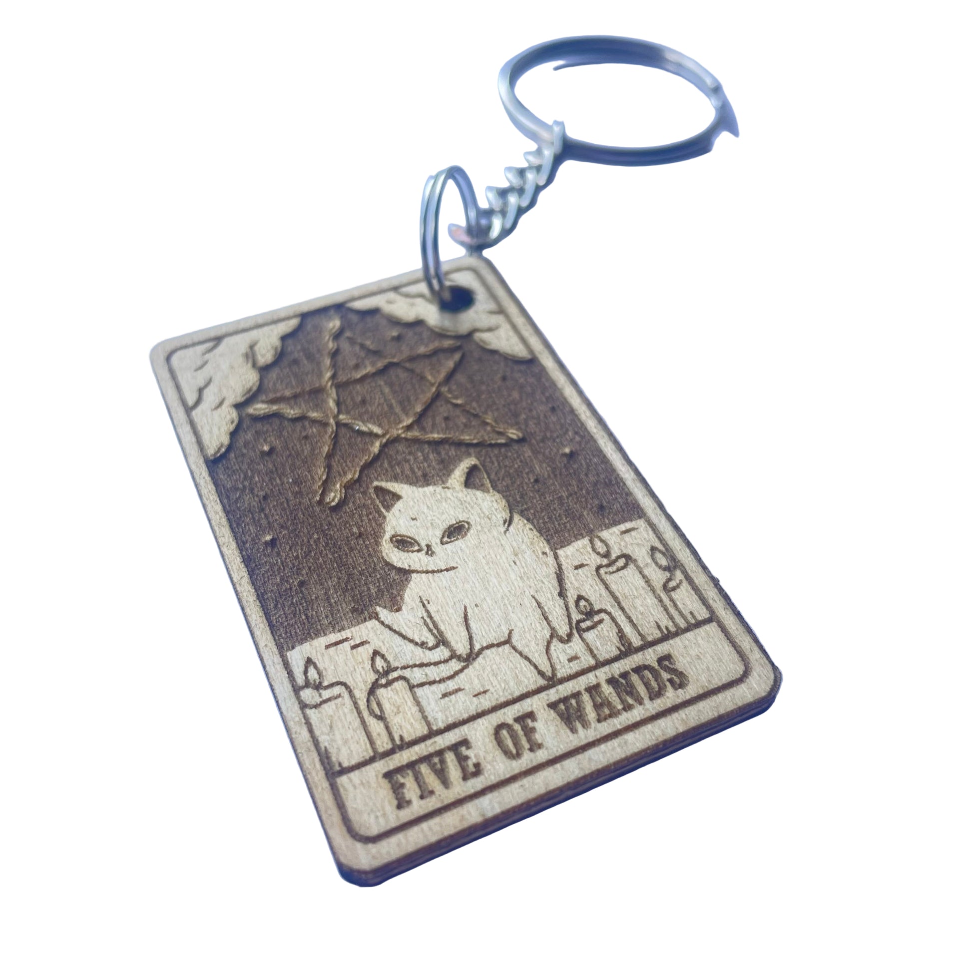 Keychain with 'Five of Wands' tarot card design on a purple background