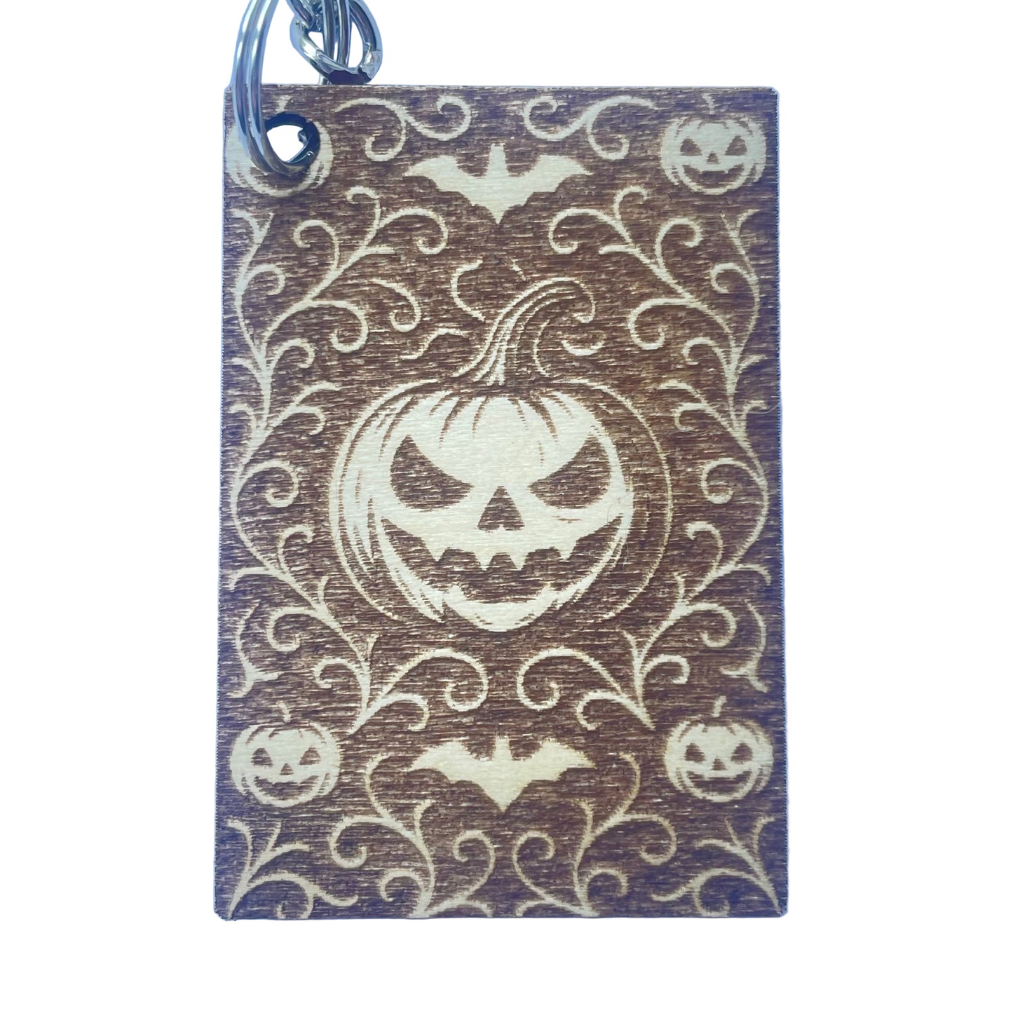 Keychain with Halloween design featuring pumpkins and bats on a blue background