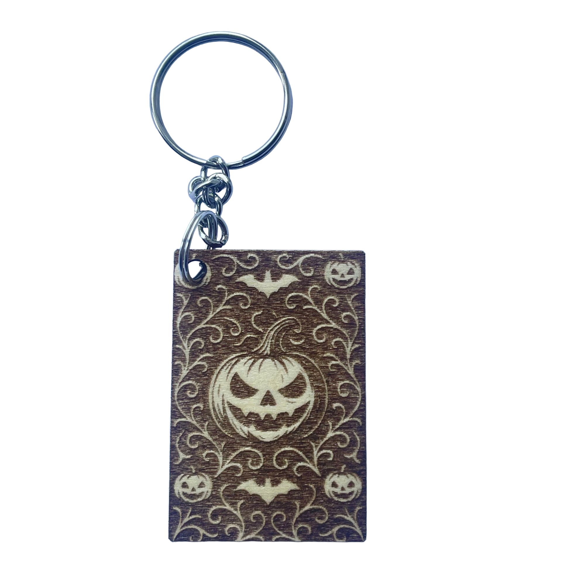 Keychain with Halloween design featuring a pumpkin face on a white background