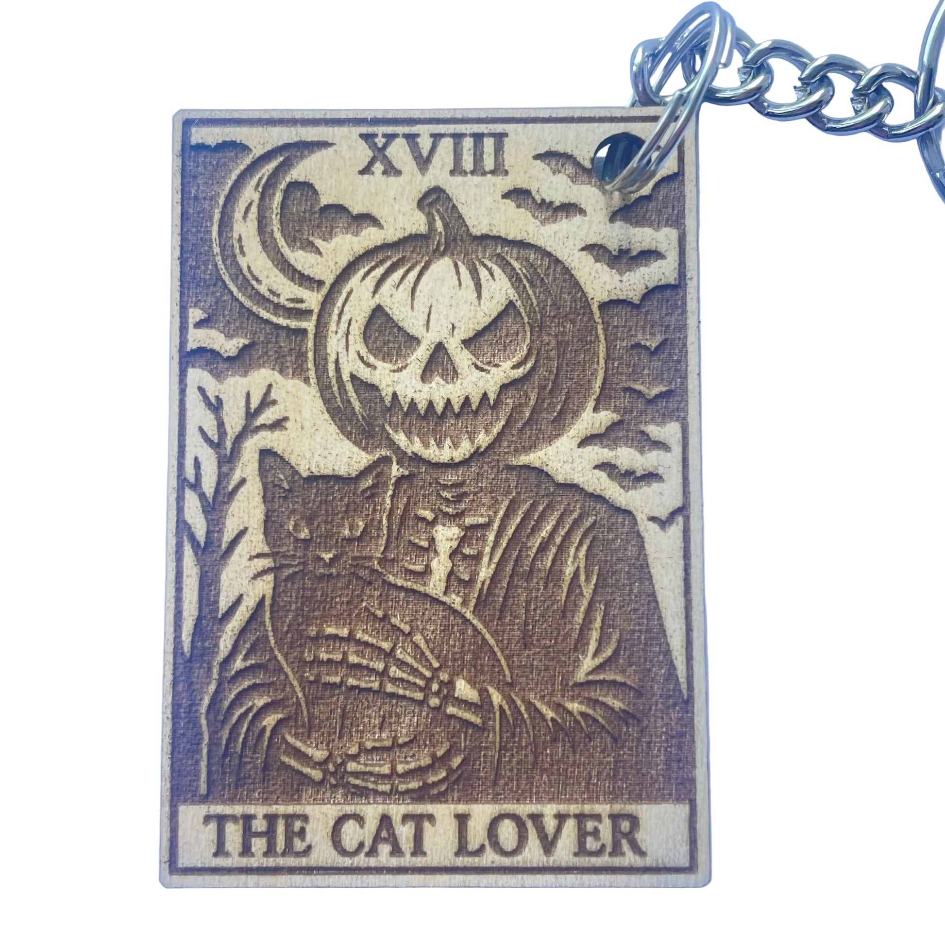 Keychain with pumpkin and cat design on a blue background
