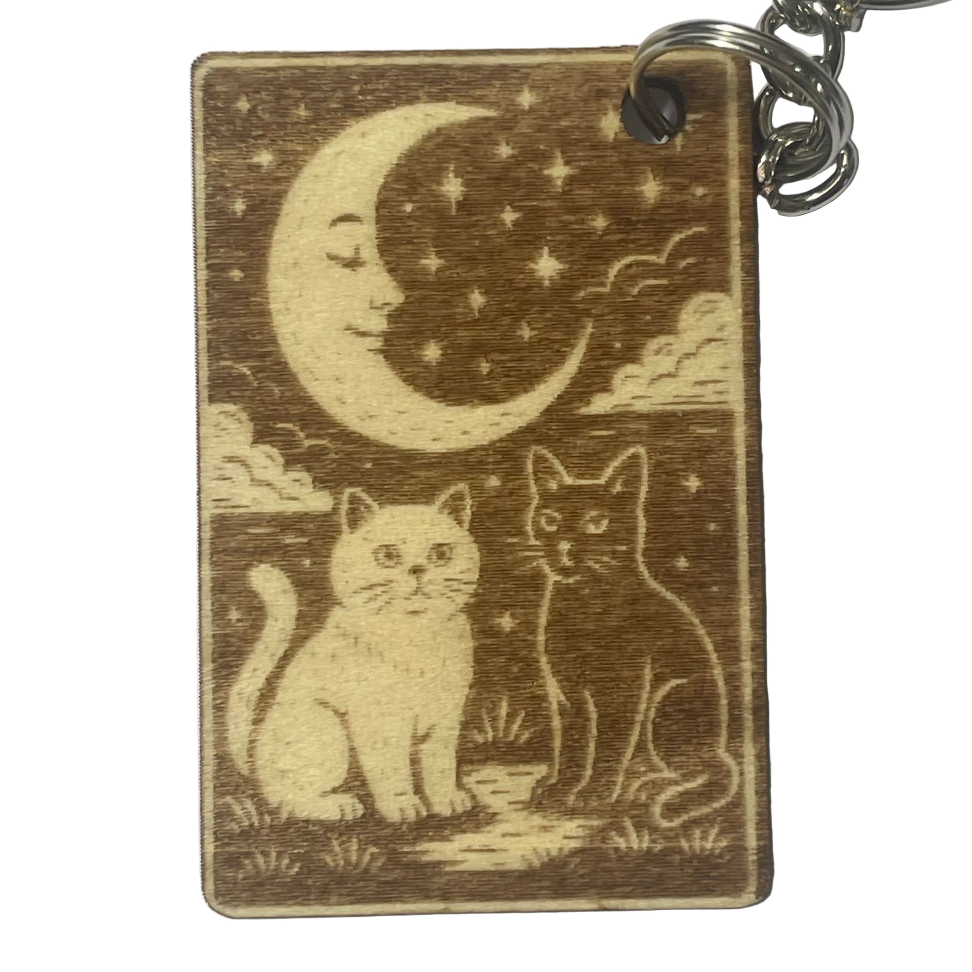 Wooden keychain with cats and a moon design on a white background