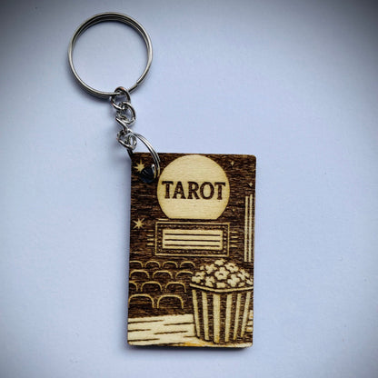 Keychain with tarot card design on a gray background